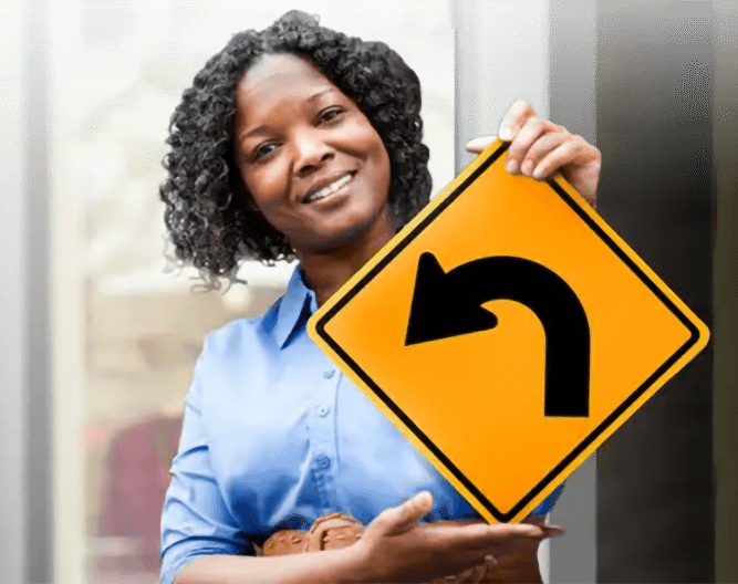 Woman holding an arrow sign